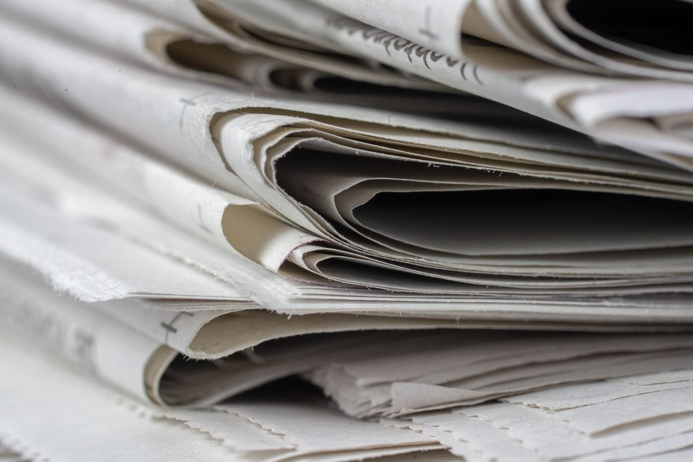Stack of published articles and print materials